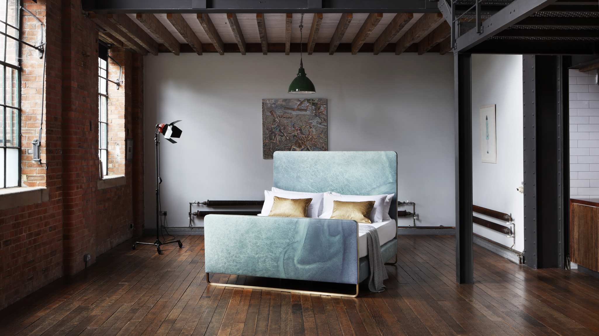 A bed designed in collaboration with Bill Amberg featuring leather upholstery adorned in ocean-like pattern