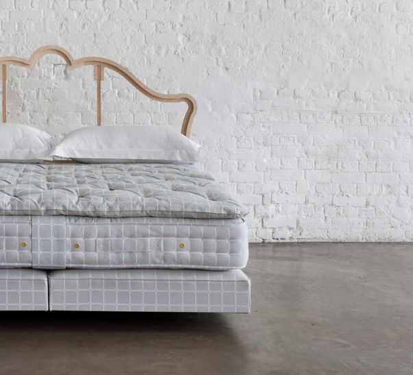 Vegan Savoir bed featuring the no4 base, the mattress, the topper and cushions with our naked headboard