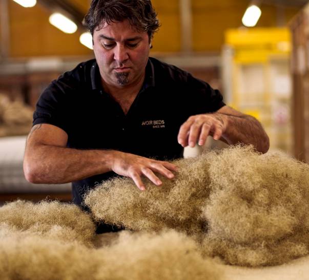 A Nº3 mattress is packed with premium natural fillings by a Savoir Beds craftsman.