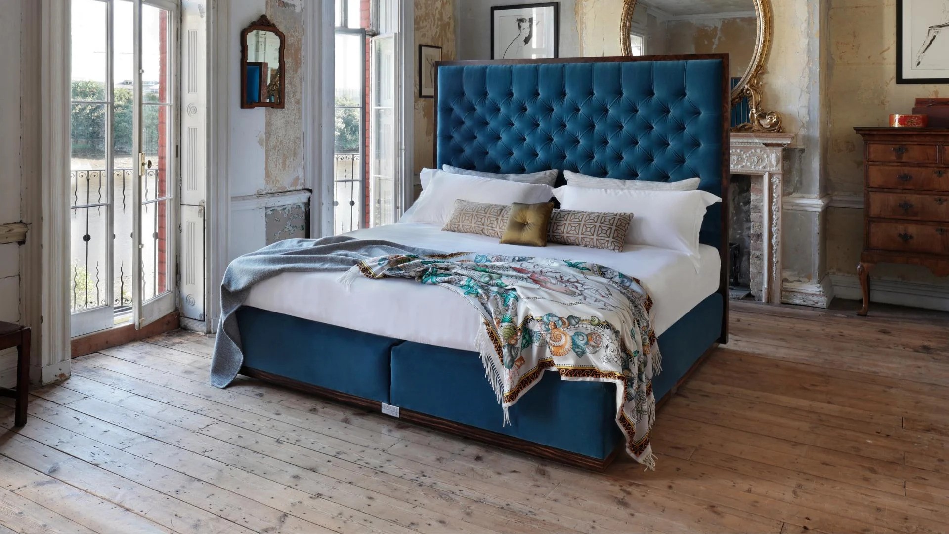 Our State bed with an handmade upholstered blue headboard and base