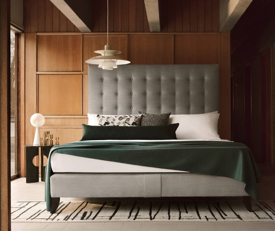Our Holly bed with gently undulating buttoning and a piped edge.
